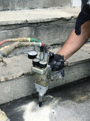 How Commercial Concrete Mudjacking Restores Uneven Surfaces